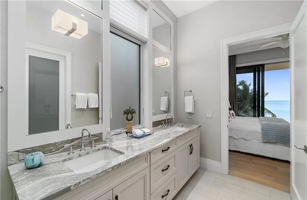 Welcome to 26854 Hickory Blvd, a 5-bed/5-bath beachfront masterpiece in Bonita Springs, FL. Built by Potter Homes and designed by Kukk Architects in 2017, this 4,647 square feet home boasts spectacular Gulf views from every floor.