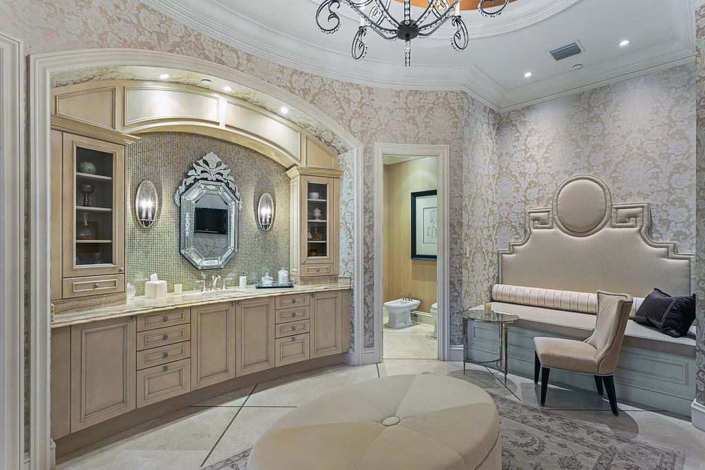 Crafted by Frankel Estate Homes, designed by Carlos Martin Architects, and styled by Marc-Michaels, this 6-bedroom, 10-bathroom mansion showcases an elegant staircase, grand salon, modern kitchen, and a lavish primary suite with waterfront vistas.