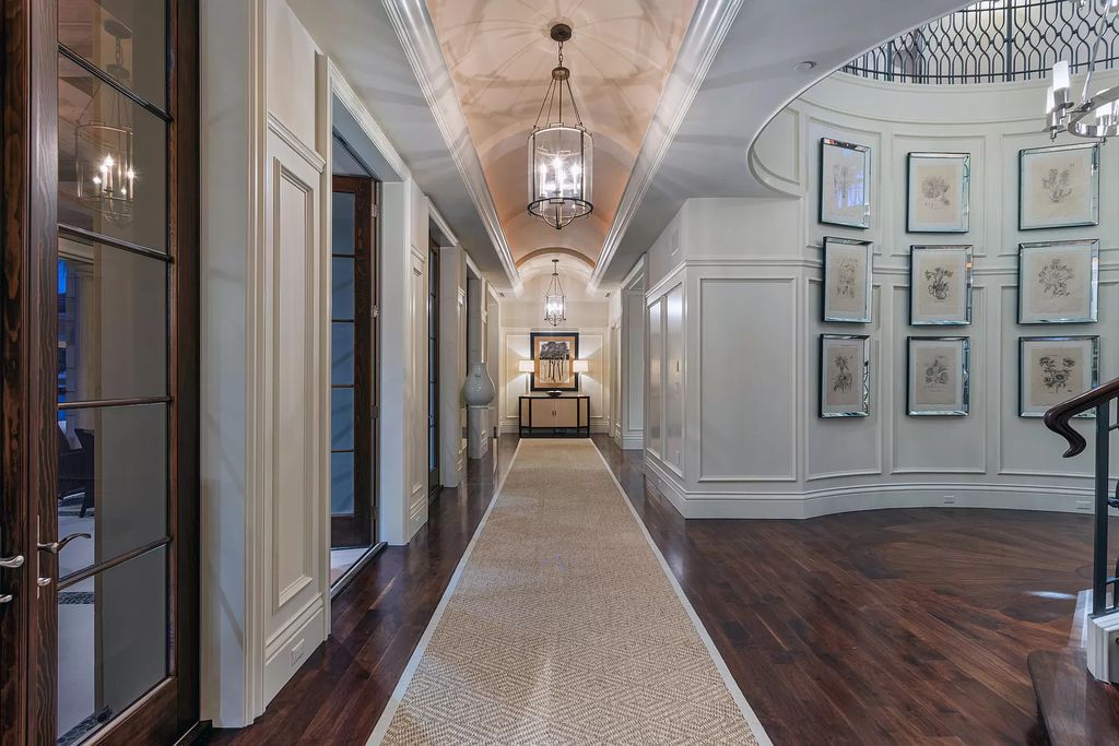 Crafted by Frankel Estate Homes, designed by Carlos Martin Architects, and styled by Marc-Michaels, this 6-bedroom, 10-bathroom mansion showcases an elegant staircase, grand salon, modern kitchen, and a lavish primary suite with waterfront vistas.