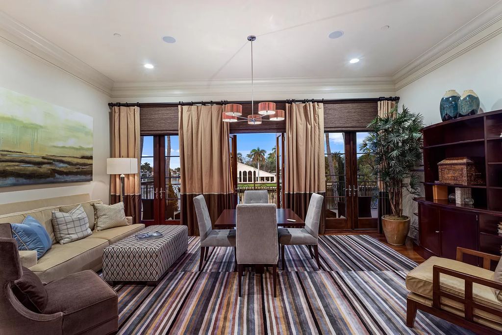 Crafted by Frankel Estate Homes, designed by Carlos Martin Architects, and styled by Marc-Michaels, this 6-bedroom, 10-bathroom mansion showcases an elegant staircase, grand salon, modern kitchen, and a lavish primary suite with waterfront vistas.