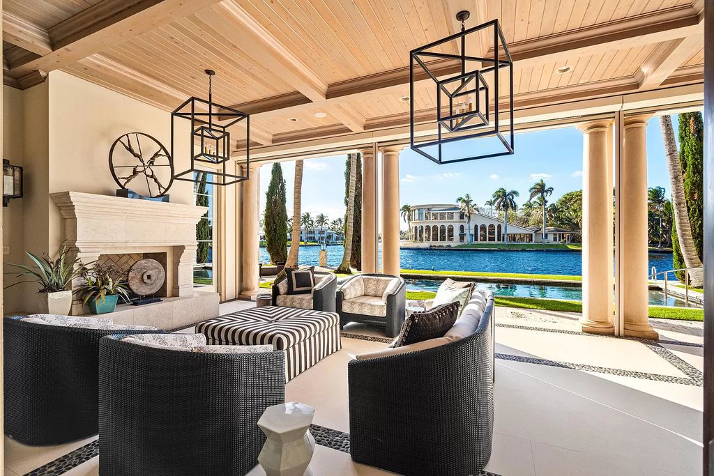 Crafted by Frankel Estate Homes, designed by Carlos Martin Architects, and styled by Marc-Michaels, this 6-bedroom, 10-bathroom mansion showcases an elegant staircase, grand salon, modern kitchen, and a lavish primary suite with waterfront vistas.