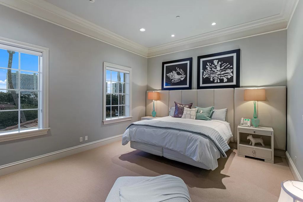 Crafted by Frankel Estate Homes, designed by Carlos Martin Architects, and styled by Marc-Michaels, this 6-bedroom, 10-bathroom mansion showcases an elegant staircase, grand salon, modern kitchen, and a lavish primary suite with waterfront vistas.