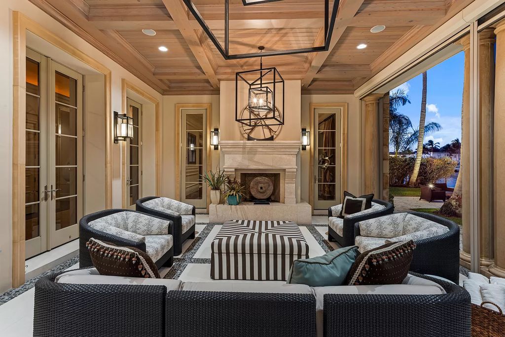 Crafted by Frankel Estate Homes, designed by Carlos Martin Architects, and styled by Marc-Michaels, this 6-bedroom, 10-bathroom mansion showcases an elegant staircase, grand salon, modern kitchen, and a lavish primary suite with waterfront vistas.