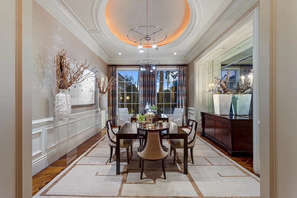 Crafted by Frankel Estate Homes, designed by Carlos Martin Architects, and styled by Marc-Michaels, this 6-bedroom, 10-bathroom mansion showcases an elegant staircase, grand salon, modern kitchen, and a lavish primary suite with waterfront vistas.