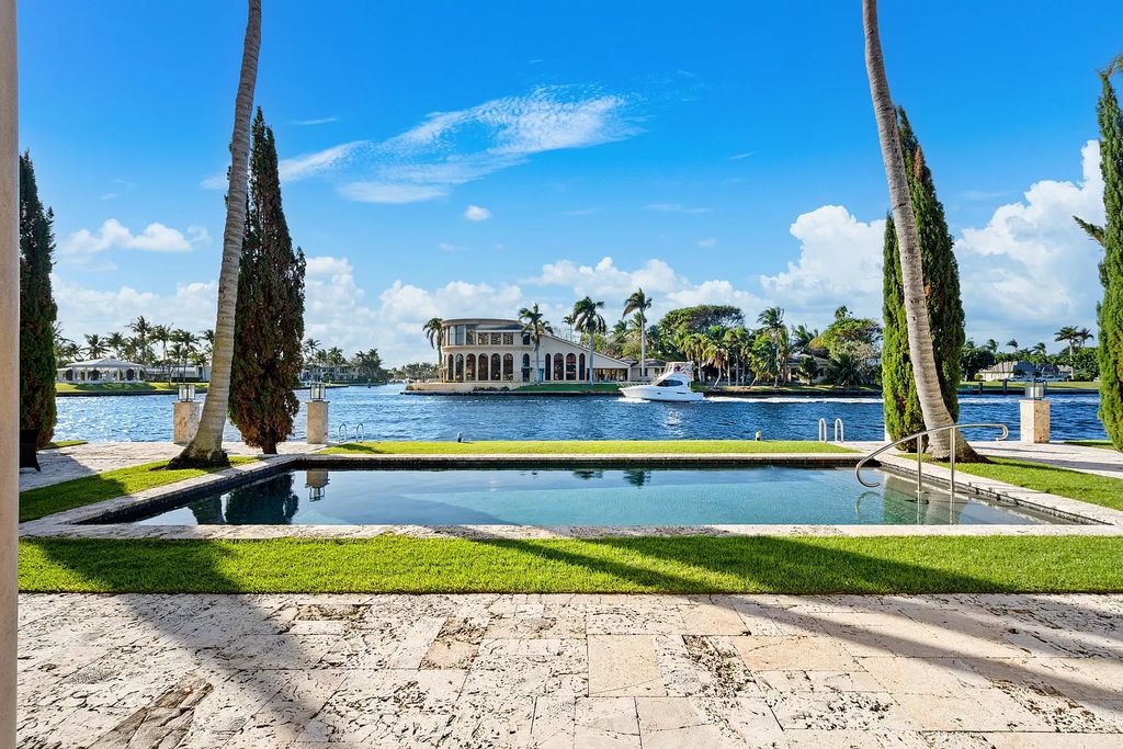 Crafted by Frankel Estate Homes, designed by Carlos Martin Architects, and styled by Marc-Michaels, this 6-bedroom, 10-bathroom mansion showcases an elegant staircase, grand salon, modern kitchen, and a lavish primary suite with waterfront vistas.