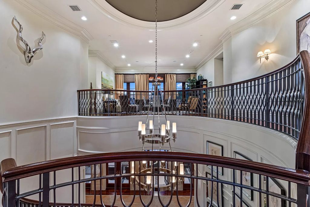 Crafted by Frankel Estate Homes, designed by Carlos Martin Architects, and styled by Marc-Michaels, this 6-bedroom, 10-bathroom mansion showcases an elegant staircase, grand salon, modern kitchen, and a lavish primary suite with waterfront vistas.