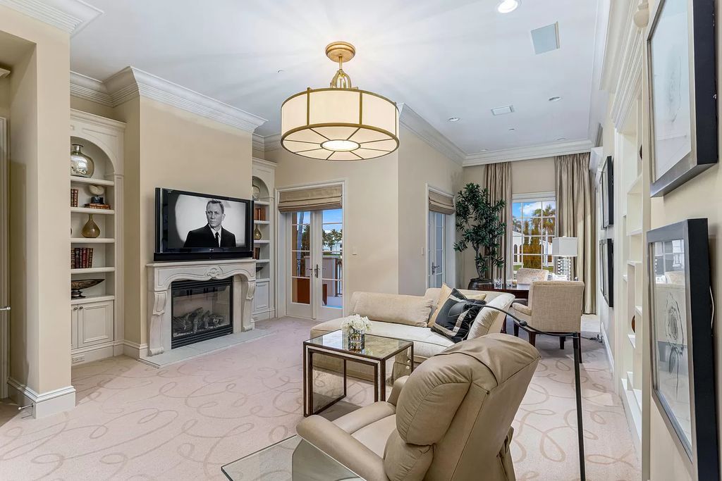 Crafted by Frankel Estate Homes, designed by Carlos Martin Architects, and styled by Marc-Michaels, this 6-bedroom, 10-bathroom mansion showcases an elegant staircase, grand salon, modern kitchen, and a lavish primary suite with waterfront vistas.