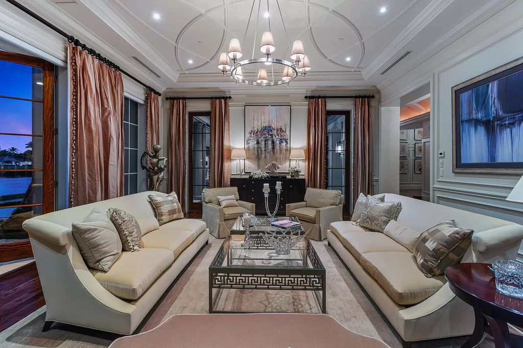 Crafted by Frankel Estate Homes, designed by Carlos Martin Architects, and styled by Marc-Michaels, this 6-bedroom, 10-bathroom mansion showcases an elegant staircase, grand salon, modern kitchen, and a lavish primary suite with waterfront vistas.