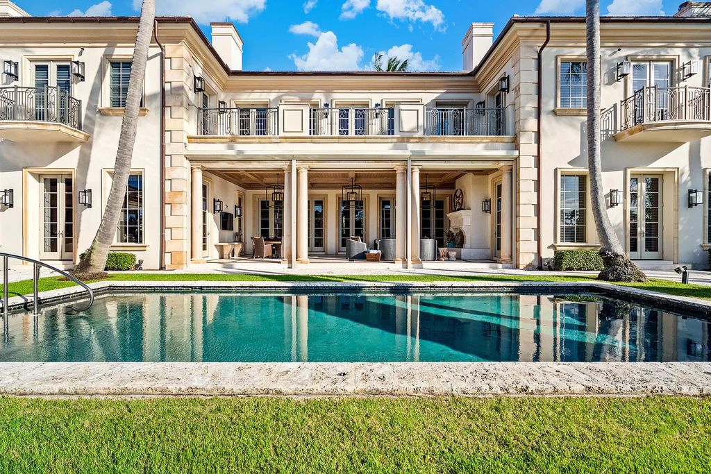 Crafted by Frankel Estate Homes, designed by Carlos Martin Architects, and styled by Marc-Michaels, this 6-bedroom, 10-bathroom mansion showcases an elegant staircase, grand salon, modern kitchen, and a lavish primary suite with waterfront vistas.