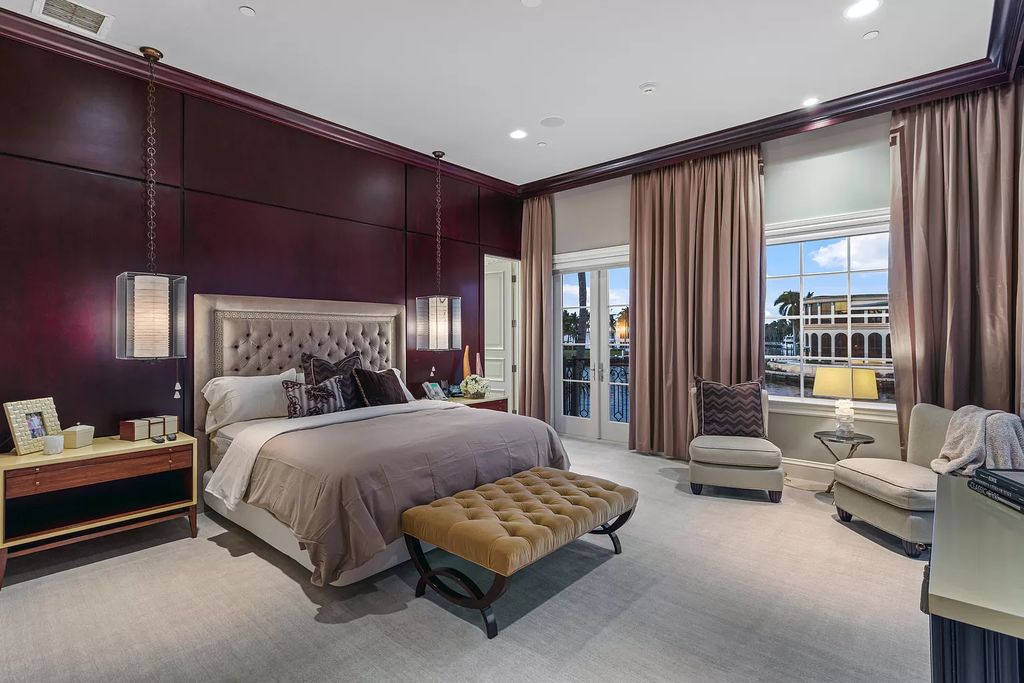 Crafted by Frankel Estate Homes, designed by Carlos Martin Architects, and styled by Marc-Michaels, this 6-bedroom, 10-bathroom mansion showcases an elegant staircase, grand salon, modern kitchen, and a lavish primary suite with waterfront vistas.