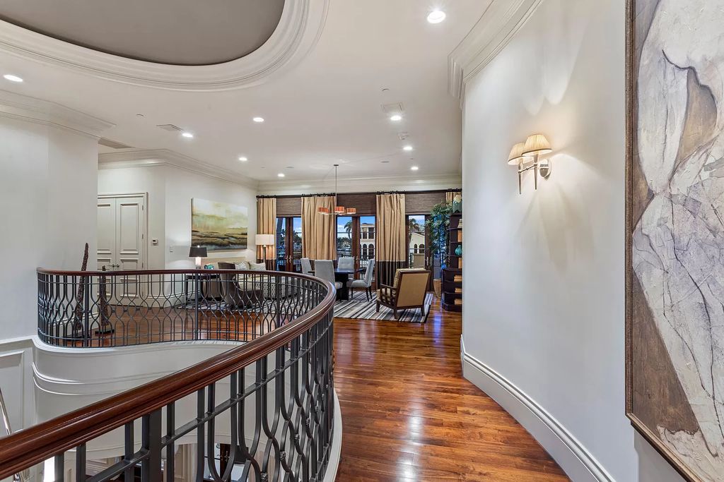 Crafted by Frankel Estate Homes, designed by Carlos Martin Architects, and styled by Marc-Michaels, this 6-bedroom, 10-bathroom mansion showcases an elegant staircase, grand salon, modern kitchen, and a lavish primary suite with waterfront vistas.
