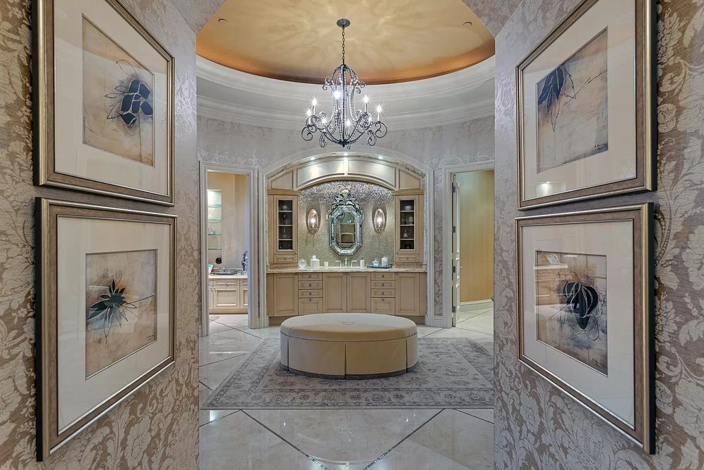Crafted by Frankel Estate Homes, designed by Carlos Martin Architects, and styled by Marc-Michaels, this 6-bedroom, 10-bathroom mansion showcases an elegant staircase, grand salon, modern kitchen, and a lavish primary suite with waterfront vistas.