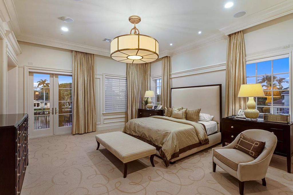 Crafted by Frankel Estate Homes, designed by Carlos Martin Architects, and styled by Marc-Michaels, this 6-bedroom, 10-bathroom mansion showcases an elegant staircase, grand salon, modern kitchen, and a lavish primary suite with waterfront vistas.