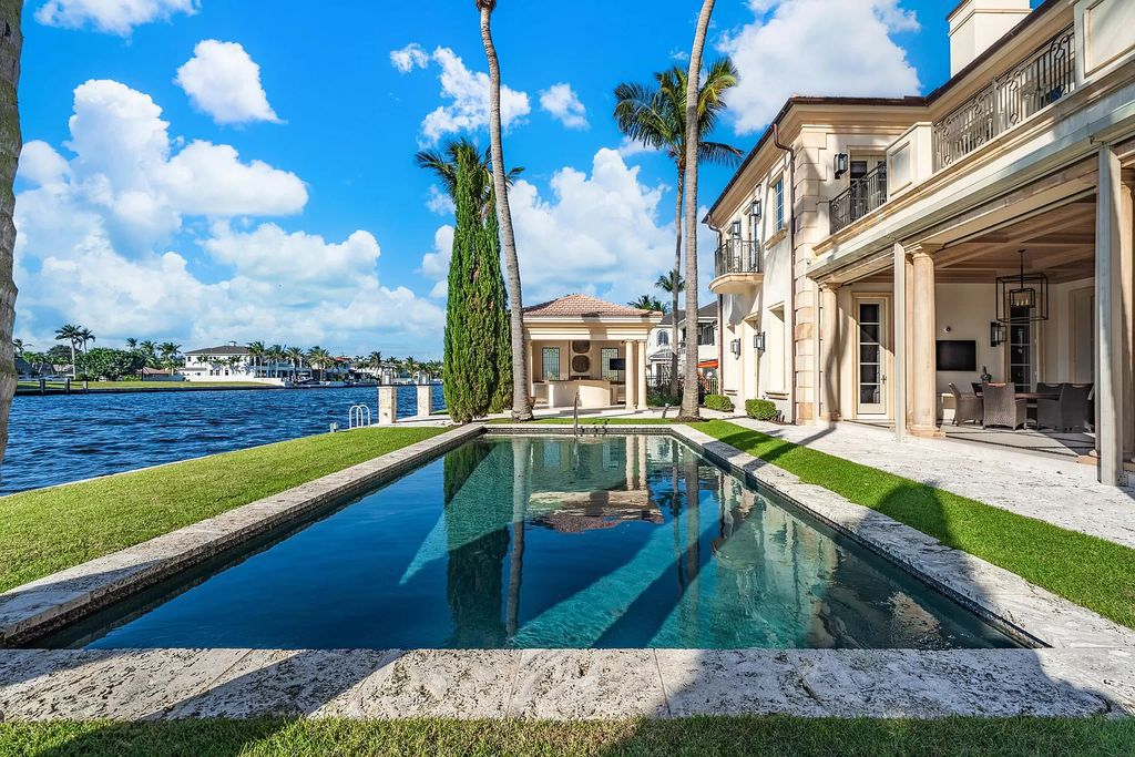 Crafted by Frankel Estate Homes, designed by Carlos Martin Architects, and styled by Marc-Michaels, this 6-bedroom, 10-bathroom mansion showcases an elegant staircase, grand salon, modern kitchen, and a lavish primary suite with waterfront vistas.