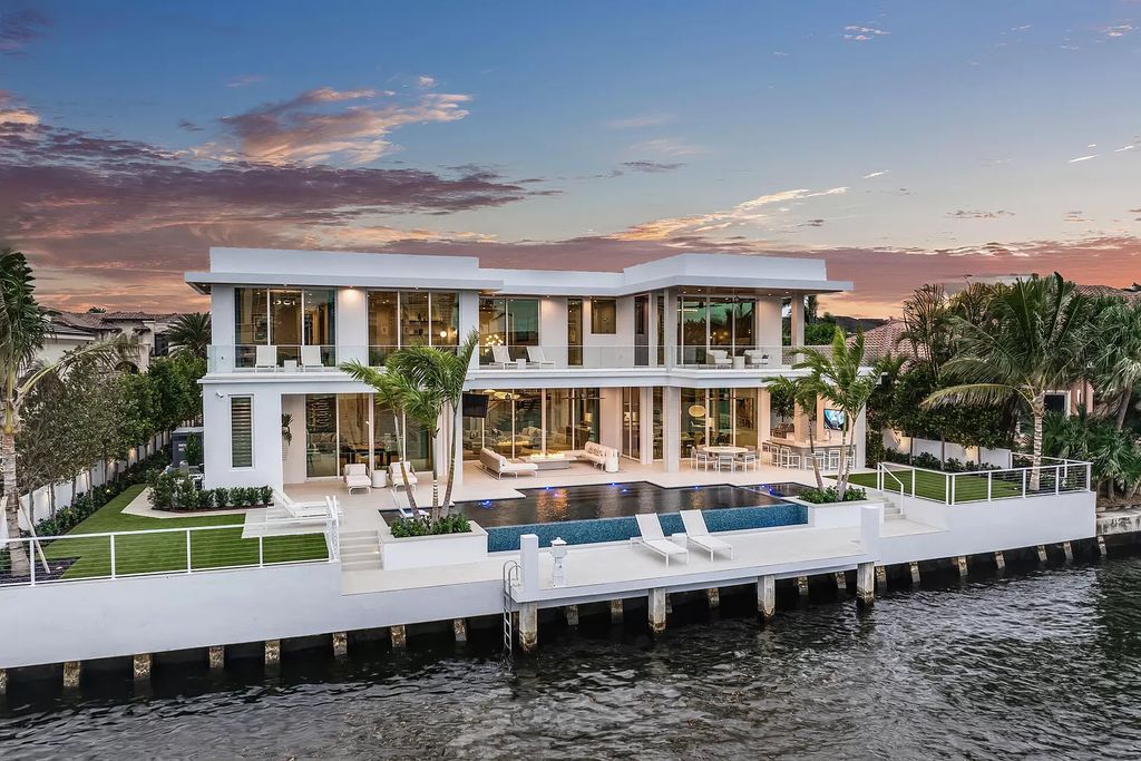 This waterfront haven boasts 6 beds, 9 baths (7 full, 2 half), and a spacious 8,921 square feet living space. Positioned on a premier Intracoastal lot, the property provides stunning water views, a private dock, and 104' of waterfrontage.