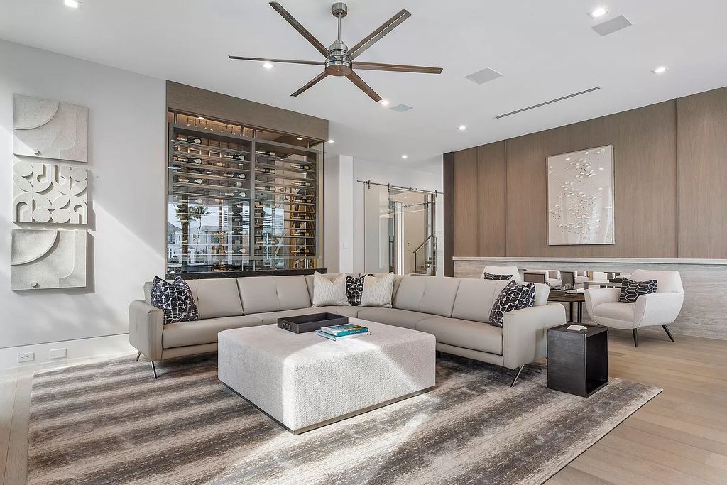 This waterfront haven boasts 6 beds, 9 baths (7 full, 2 half), and a spacious 8,921 square feet living space. Positioned on a premier Intracoastal lot, the property provides stunning water views, a private dock, and 104' of waterfrontage.