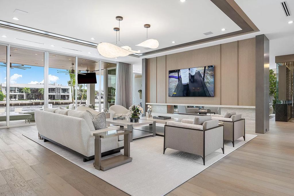 This waterfront haven boasts 6 beds, 9 baths (7 full, 2 half), and a spacious 8,921 square feet living space. Positioned on a premier Intracoastal lot, the property provides stunning water views, a private dock, and 104' of waterfrontage.