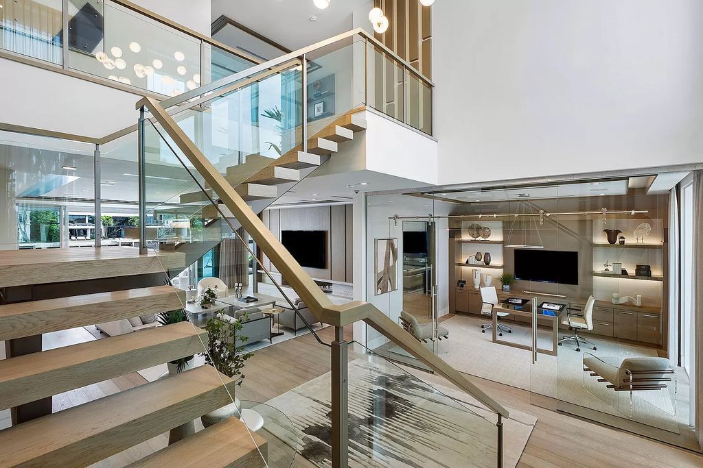 This waterfront haven boasts 6 beds, 9 baths (7 full, 2 half), and a spacious 8,921 square feet living space. Positioned on a premier Intracoastal lot, the property provides stunning water views, a private dock, and 104' of waterfrontage.