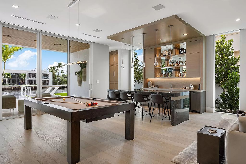 This waterfront haven boasts 6 beds, 9 baths (7 full, 2 half), and a spacious 8,921 square feet living space. Positioned on a premier Intracoastal lot, the property provides stunning water views, a private dock, and 104' of waterfrontage.