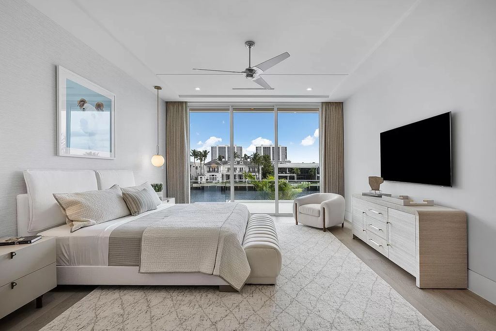 This waterfront haven boasts 6 beds, 9 baths (7 full, 2 half), and a spacious 8,921 square feet living space. Positioned on a premier Intracoastal lot, the property provides stunning water views, a private dock, and 104' of waterfrontage.
