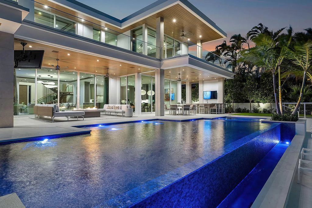 This waterfront haven boasts 6 beds, 9 baths (7 full, 2 half), and a spacious 8,921 square feet living space. Positioned on a premier Intracoastal lot, the property provides stunning water views, a private dock, and 104' of waterfrontage.