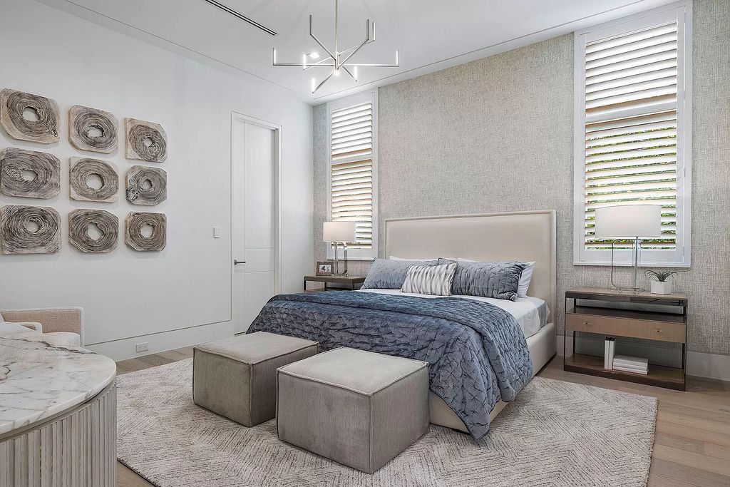 This waterfront haven boasts 6 beds, 9 baths (7 full, 2 half), and a spacious 8,921 square feet living space. Positioned on a premier Intracoastal lot, the property provides stunning water views, a private dock, and 104' of waterfrontage.