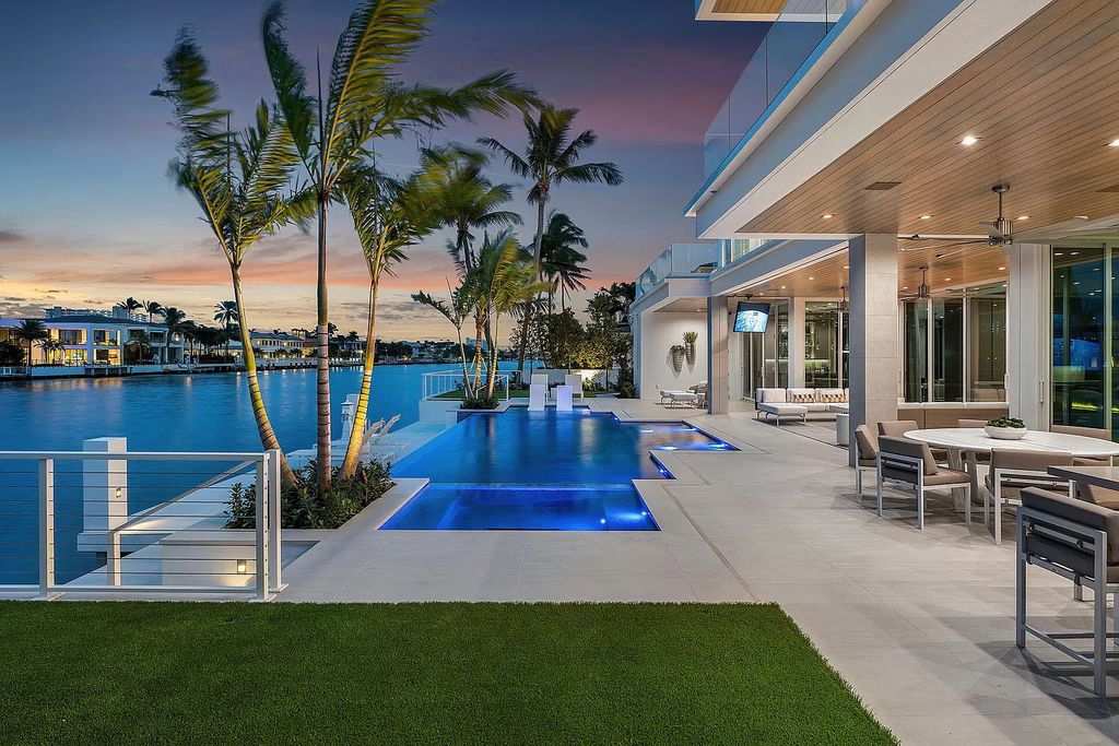 This waterfront haven boasts 6 beds, 9 baths (7 full, 2 half), and a spacious 8,921 square feet living space. Positioned on a premier Intracoastal lot, the property provides stunning water views, a private dock, and 104' of waterfrontage.