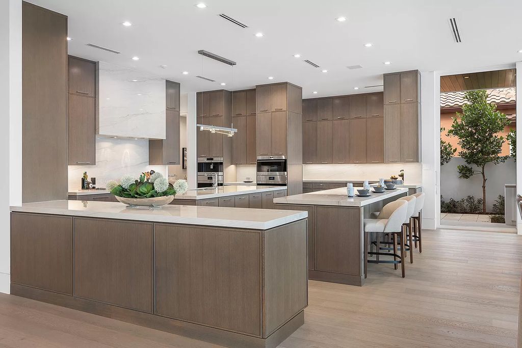 This waterfront haven boasts 6 beds, 9 baths (7 full, 2 half), and a spacious 8,921 square feet living space. Positioned on a premier Intracoastal lot, the property provides stunning water views, a private dock, and 104' of waterfrontage.