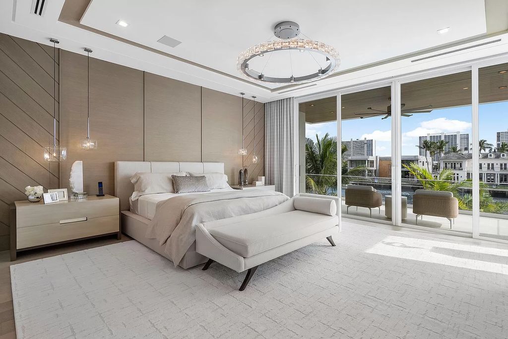 This waterfront haven boasts 6 beds, 9 baths (7 full, 2 half), and a spacious 8,921 square feet living space. Positioned on a premier Intracoastal lot, the property provides stunning water views, a private dock, and 104' of waterfrontage.