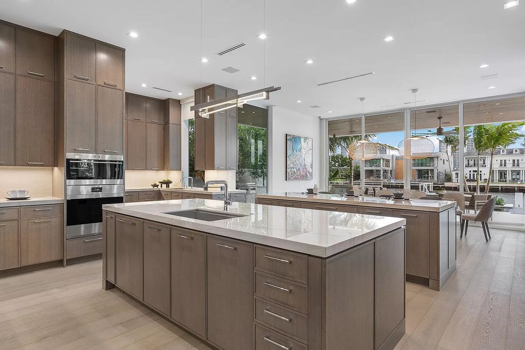 This waterfront haven boasts 6 beds, 9 baths (7 full, 2 half), and a spacious 8,921 square feet living space. Positioned on a premier Intracoastal lot, the property provides stunning water views, a private dock, and 104' of waterfrontage.