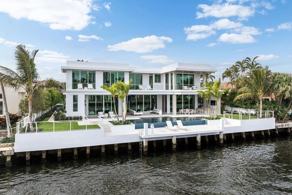 This waterfront haven boasts 6 beds, 9 baths (7 full, 2 half), and a spacious 8,921 square feet living space. Positioned on a premier Intracoastal lot, the property provides stunning water views, a private dock, and 104' of waterfrontage.