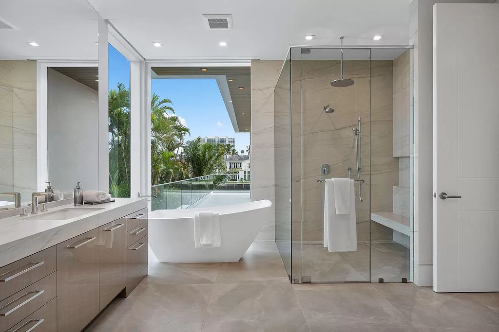 This waterfront haven boasts 6 beds, 9 baths (7 full, 2 half), and a spacious 8,921 square feet living space. Positioned on a premier Intracoastal lot, the property provides stunning water views, a private dock, and 104' of waterfrontage.