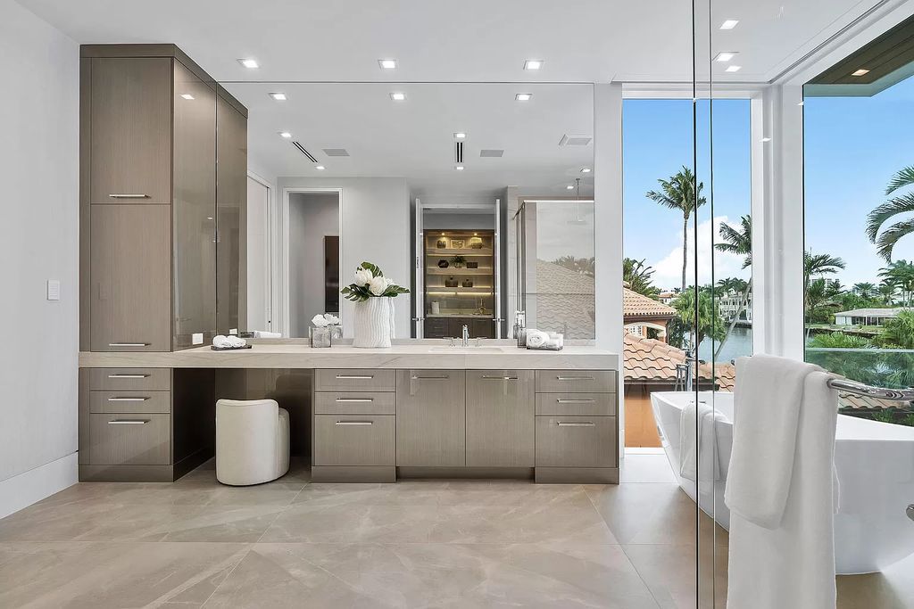 This waterfront haven boasts 6 beds, 9 baths (7 full, 2 half), and a spacious 8,921 square feet living space. Positioned on a premier Intracoastal lot, the property provides stunning water views, a private dock, and 104' of waterfrontage.