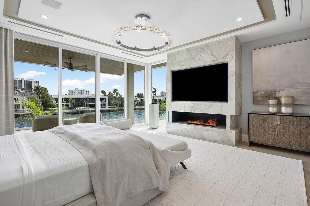 This waterfront haven boasts 6 beds, 9 baths (7 full, 2 half), and a spacious 8,921 square feet living space. Positioned on a premier Intracoastal lot, the property provides stunning water views, a private dock, and 104' of waterfrontage.