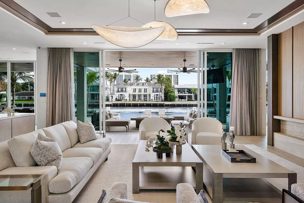 This waterfront haven boasts 6 beds, 9 baths (7 full, 2 half), and a spacious 8,921 square feet living space. Positioned on a premier Intracoastal lot, the property provides stunning water views, a private dock, and 104' of waterfrontage.