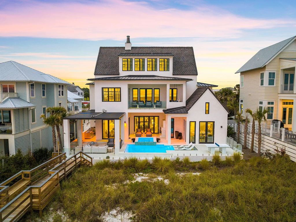 Nestled along the sought-after 30A coastline, this exceptional property, crafted by renowned architect Matt Savois, boasts 8 bedrooms, 9 bathrooms, and spans 6,994 square feet, showcasing exquisite craftsmanship and timeless sophistication.