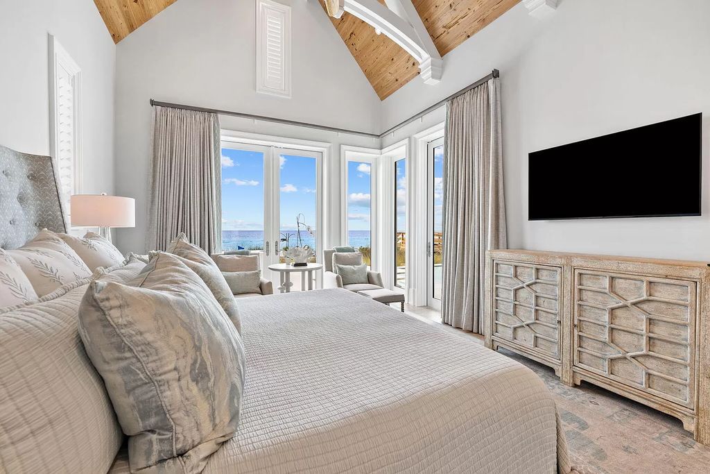 Nestled along the sought-after 30A coastline, this exceptional property, crafted by renowned architect Matt Savois, boasts 8 bedrooms, 9 bathrooms, and spans 6,994 square feet, showcasing exquisite craftsmanship and timeless sophistication.