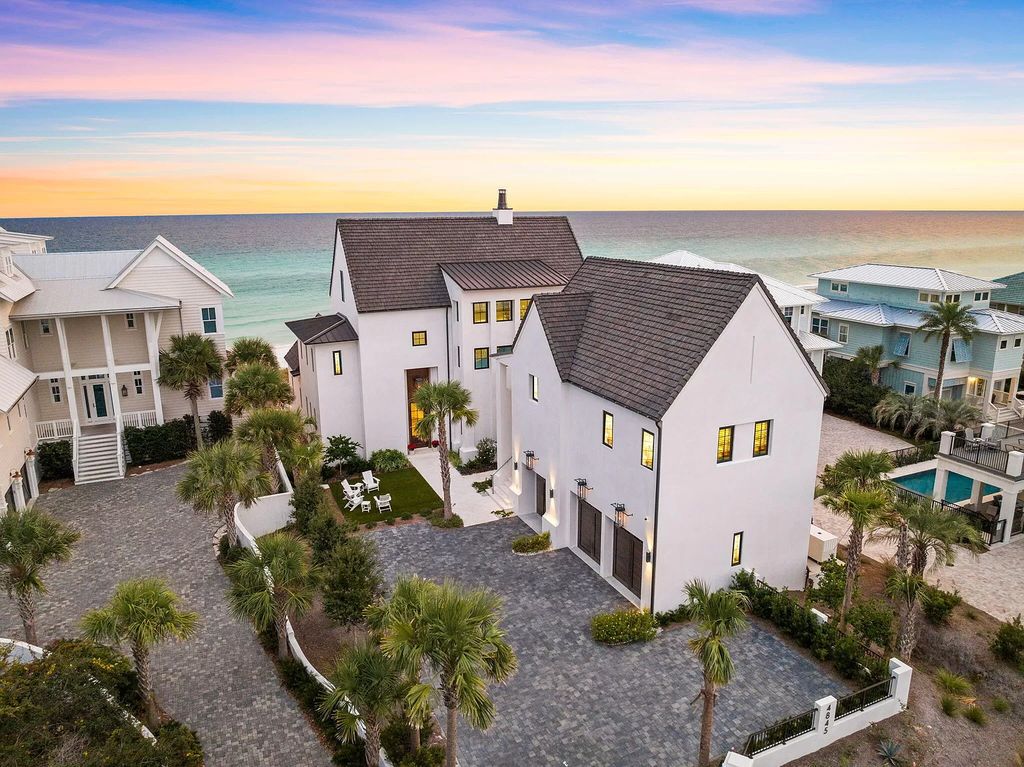 Nestled along the sought-after 30A coastline, this exceptional property, crafted by renowned architect Matt Savois, boasts 8 bedrooms, 9 bathrooms, and spans 6,994 square feet, showcasing exquisite craftsmanship and timeless sophistication.