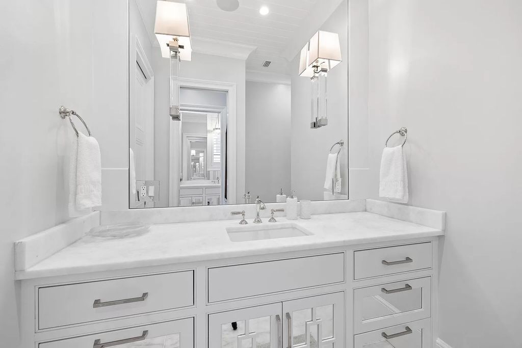 Nestled along the sought-after 30A coastline, this exceptional property, crafted by renowned architect Matt Savois, boasts 8 bedrooms, 9 bathrooms, and spans 6,994 square feet, showcasing exquisite craftsmanship and timeless sophistication.