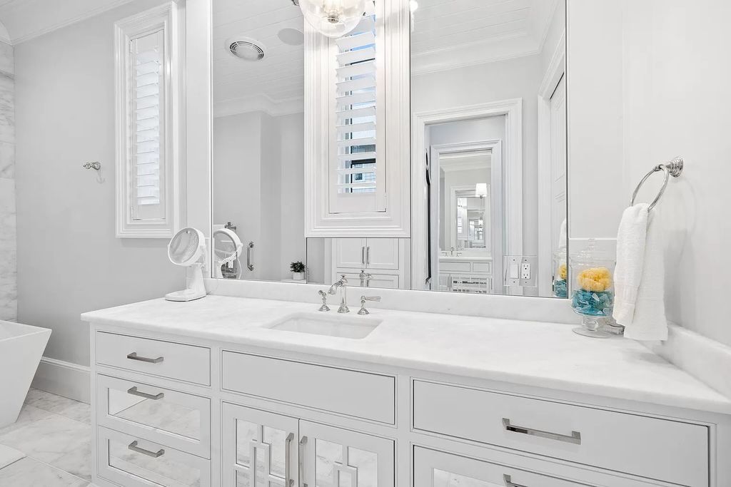 Nestled along the sought-after 30A coastline, this exceptional property, crafted by renowned architect Matt Savois, boasts 8 bedrooms, 9 bathrooms, and spans 6,994 square feet, showcasing exquisite craftsmanship and timeless sophistication.