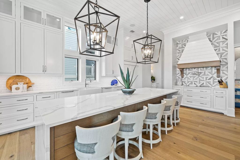 Nestled along the sought-after 30A coastline, this exceptional property, crafted by renowned architect Matt Savois, boasts 8 bedrooms, 9 bathrooms, and spans 6,994 square feet, showcasing exquisite craftsmanship and timeless sophistication.