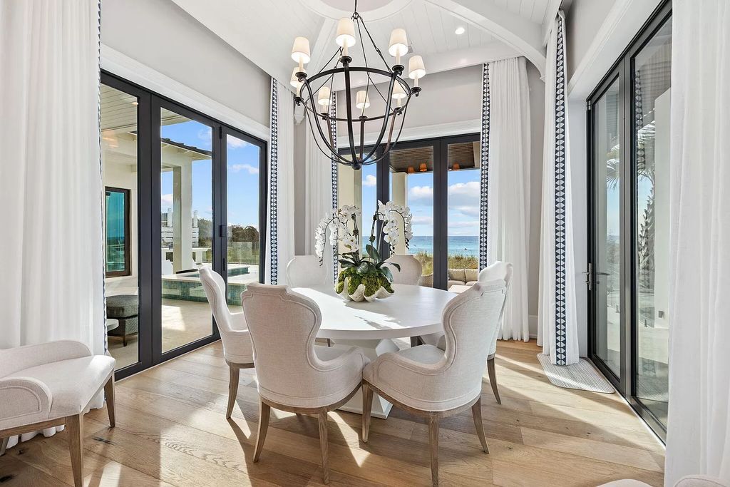 Nestled along the sought-after 30A coastline, this exceptional property, crafted by renowned architect Matt Savois, boasts 8 bedrooms, 9 bathrooms, and spans 6,994 square feet, showcasing exquisite craftsmanship and timeless sophistication.