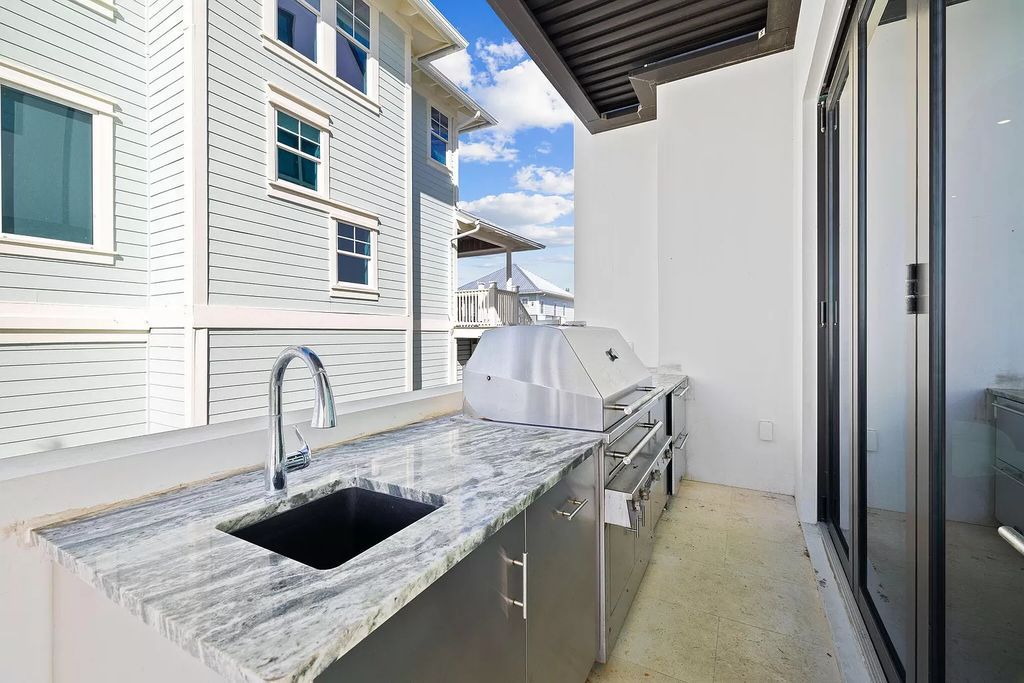 Nestled along the sought-after 30A coastline, this exceptional property, crafted by renowned architect Matt Savois, boasts 8 bedrooms, 9 bathrooms, and spans 6,994 square feet, showcasing exquisite craftsmanship and timeless sophistication.
