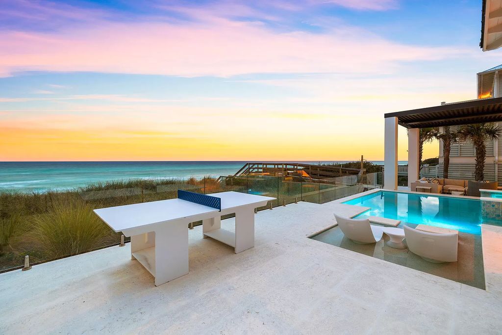 Nestled along the sought-after 30A coastline, this exceptional property, crafted by renowned architect Matt Savois, boasts 8 bedrooms, 9 bathrooms, and spans 6,994 square feet, showcasing exquisite craftsmanship and timeless sophistication.