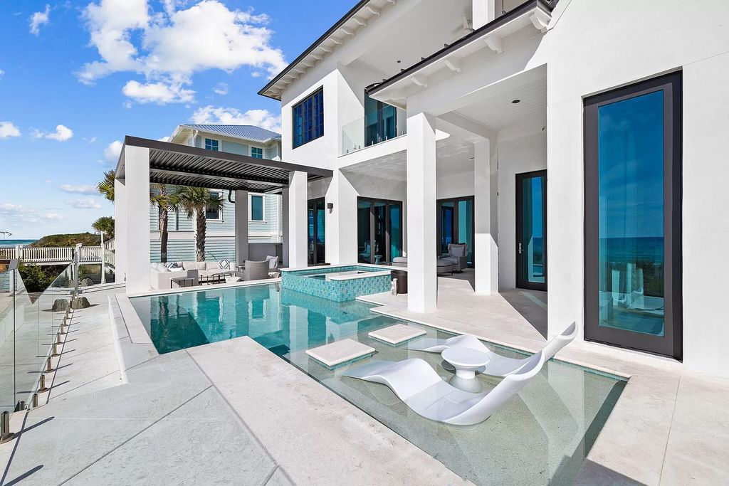 Nestled along the sought-after 30A coastline, this exceptional property, crafted by renowned architect Matt Savois, boasts 8 bedrooms, 9 bathrooms, and spans 6,994 square feet, showcasing exquisite craftsmanship and timeless sophistication.