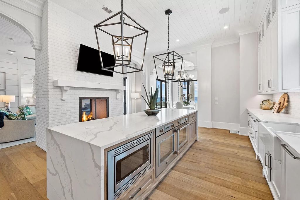 Nestled along the sought-after 30A coastline, this exceptional property, crafted by renowned architect Matt Savois, boasts 8 bedrooms, 9 bathrooms, and spans 6,994 square feet, showcasing exquisite craftsmanship and timeless sophistication.