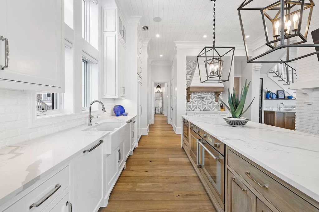 Nestled along the sought-after 30A coastline, this exceptional property, crafted by renowned architect Matt Savois, boasts 8 bedrooms, 9 bathrooms, and spans 6,994 square feet, showcasing exquisite craftsmanship and timeless sophistication.