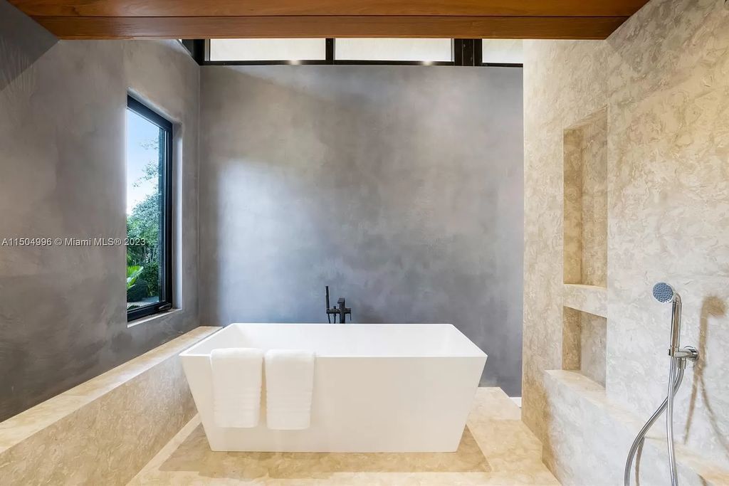 Discover the epitome of tropical luxury living at the Sir Crawford residence in Miami, perfectly situated near top schools and Grove amenities.
