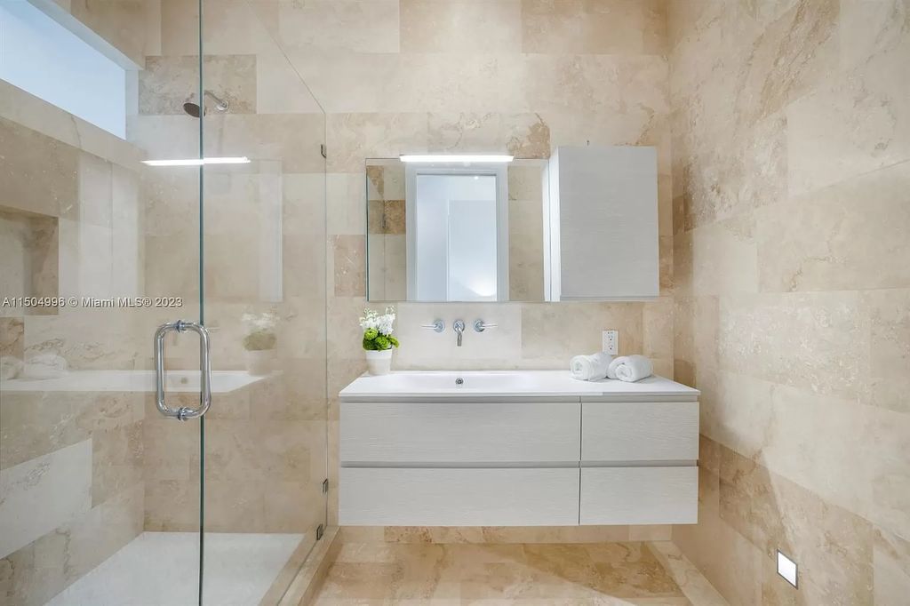 Discover the epitome of tropical luxury living at the Sir Crawford residence in Miami, perfectly situated near top schools and Grove amenities.