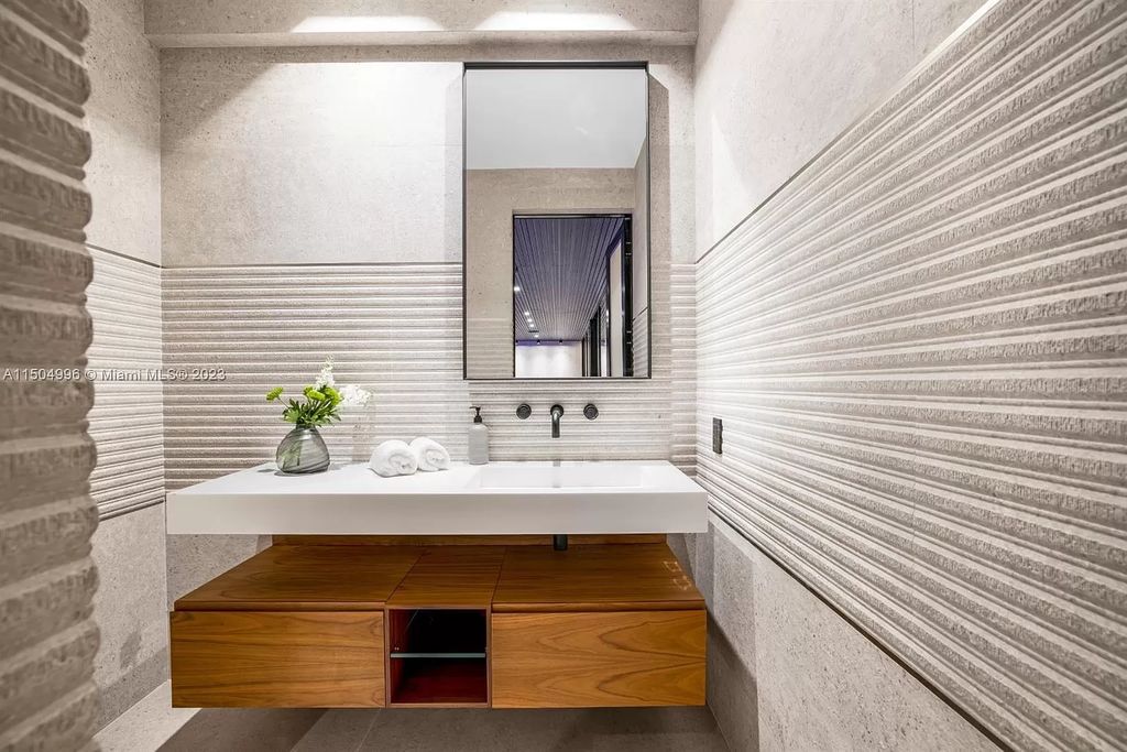 Discover the epitome of tropical luxury living at the Sir Crawford residence in Miami, perfectly situated near top schools and Grove amenities.